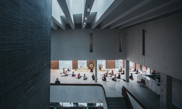 a photo of a yoga class in NOSPR foyer